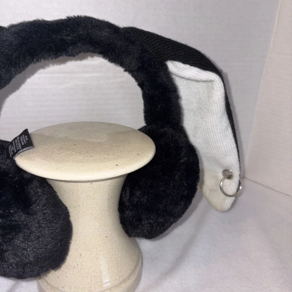 A Pair Of Black, Plush Earmuffs With Poseable Rabbit, Ears, And‎ Earrings.